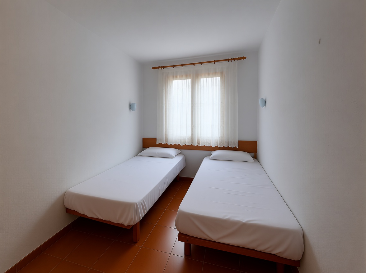 Ático en primera línea de mar en Es Mercadal — Dormitorio