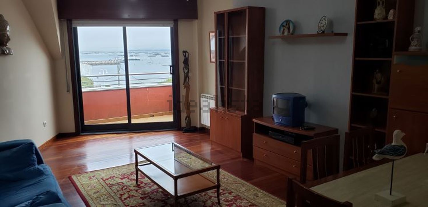 Appartement en attique en première ligne de mer à O Grove — Séjour