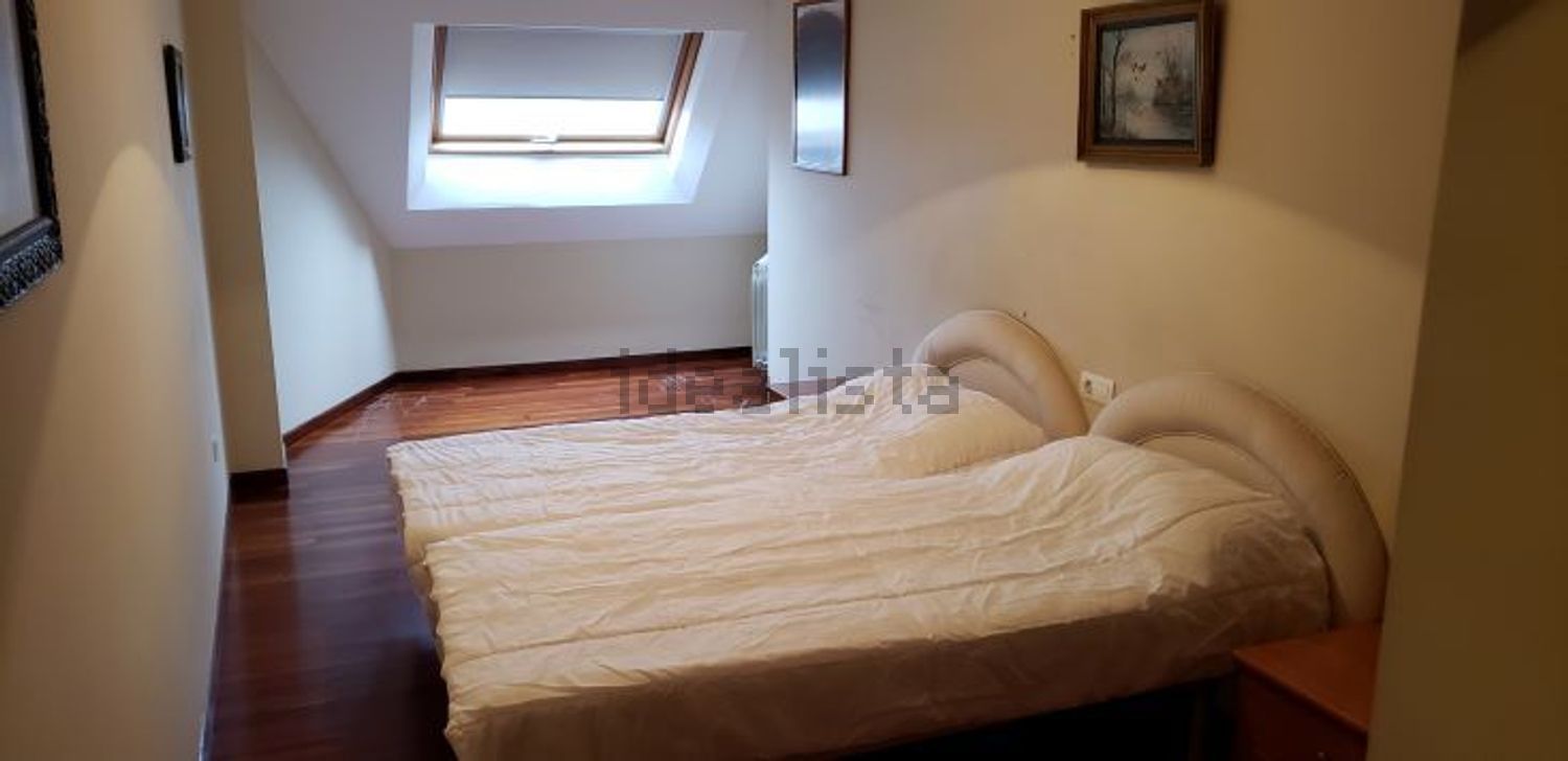 Appartement en attique en première ligne de mer à O Grove — Chambre