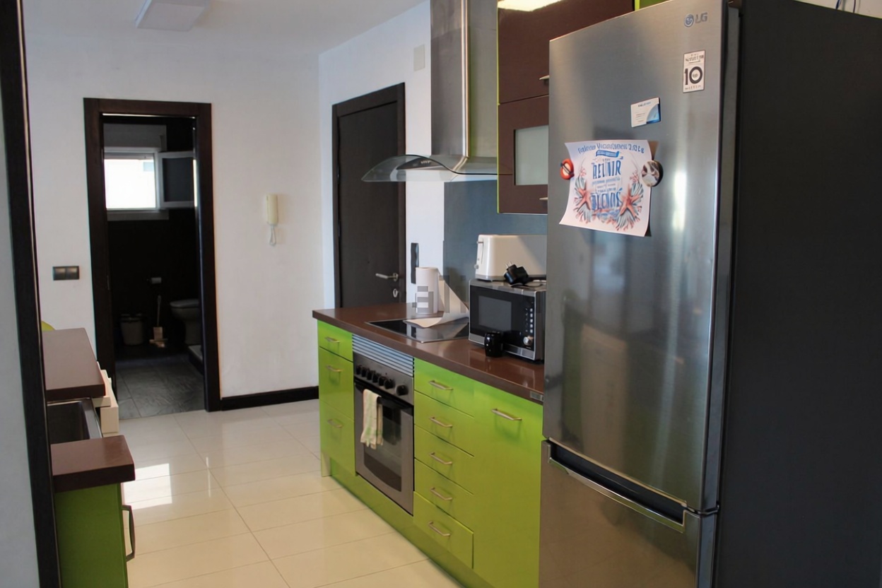 Appartement en première ligne de plage à Roquetas de Mar — Cuisine